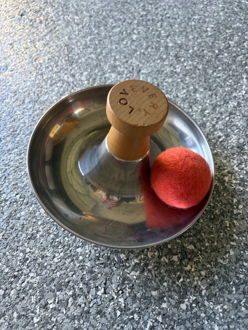 Lovevery Stainless Steel Bowl Spinner with Wooden Handle & Red Felt Ball